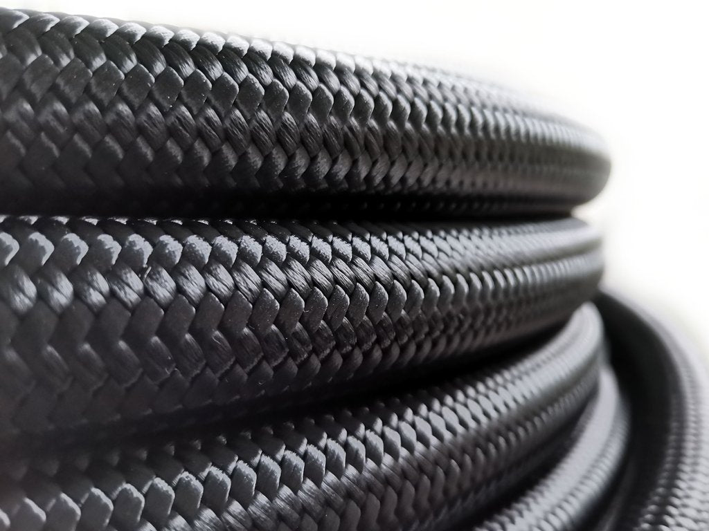 AN12 PTFE Teflon letku Teräspunoksella (musta nylon)