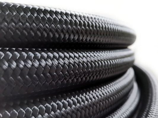 AN12 PTFE Teflon letku Teräspunoksella (musta nylon)